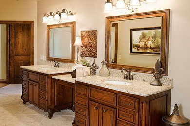 Design ideas for a transitional bathroom in Other with raised-panel cabinets, dark wood cabinets, beige walls, ceramic floors, an undermount sink and granite benchtops.