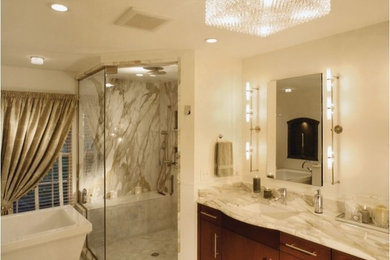 Bathroom - large contemporary master stone slab porcelain tile bathroom idea in Cleveland with flat-panel cabinets, dark wood cabinets, white walls, an undermount sink and marble countertops