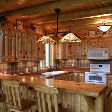Upper and lower custom cabinets done in knotty pine