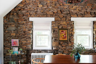 Inspiration for a mid-sized eclectic medium tone wood floor and brown floor dining room remodel in Philadelphia with gray walls and no fireplace