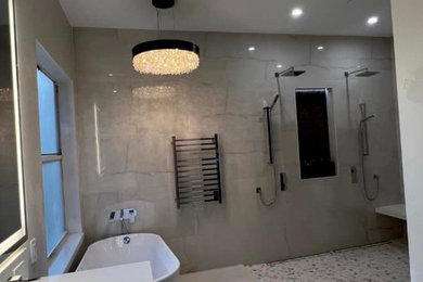 Large minimalist master porcelain tile porcelain tile and beige floor doorless shower photo in Orlando with beige walls