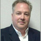 John Sikacs foto