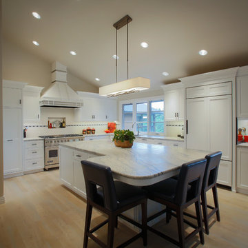 After kitchen, note custom hood, vaulted ceilings