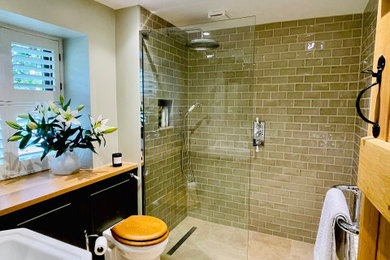 Inspiration for a classic bathroom in Oxfordshire with wooden worktops.