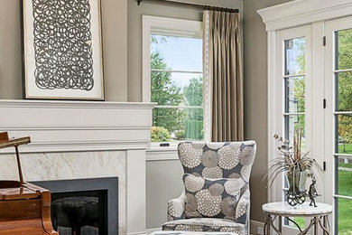 Mid-sized transitional enclosed medium tone wood floor and brown floor living room photo in Chicago with a music area, gray walls, a standard fireplace, a stone fireplace and no tv