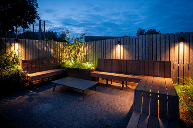 Photo of a small contemporary back full sun garden for summer in Glasgow with decking and a wood fence.