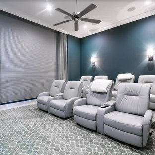 Inspiration for a medium sized traditional enclosed home cinema in Sacramento with blue walls, carpet and grey floors.