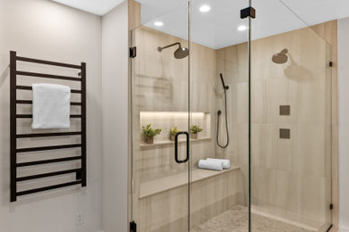 Bathroom - huge transitional master beige tile and porcelain tile porcelain tile, beige floor and double-sink bathroom idea in Milwaukee with shaker cabinets, medium tone wood cabinets, a two-piece toilet, beige walls, an undermount sink, quartz countertops, a hinged shower door, white countertops and a freestanding vanity