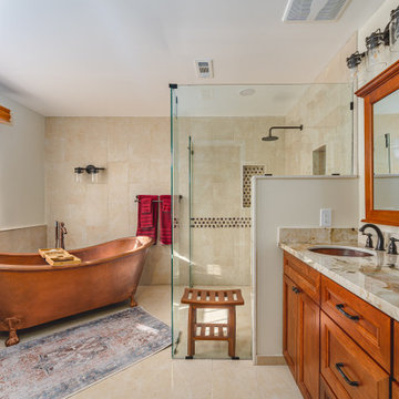 Master Bathroom Remodel in Reston, VA with free-standing copper bathtub & brass