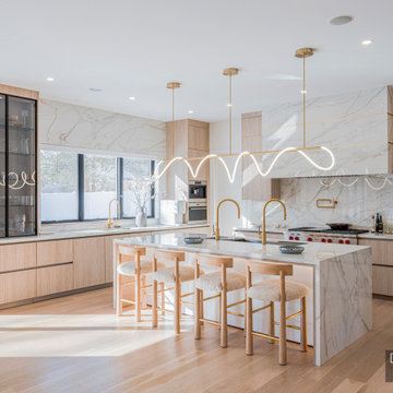 Sculptural Serenity: Dual-Faucet Marble Kitchen in Newton