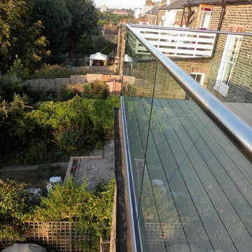 Balcony Transformation with Glass Balustrade and Composite Decking