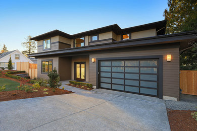 Large contemporary brown two-story mixed siding house exterior idea in San Diego with a hip roof