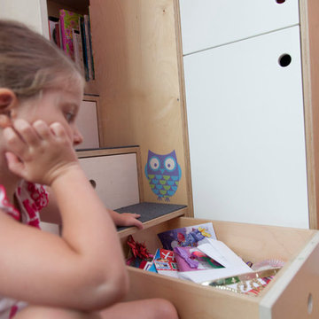 Boerum Hill; A small face is fitted with a loft bed and built-in cabinets
