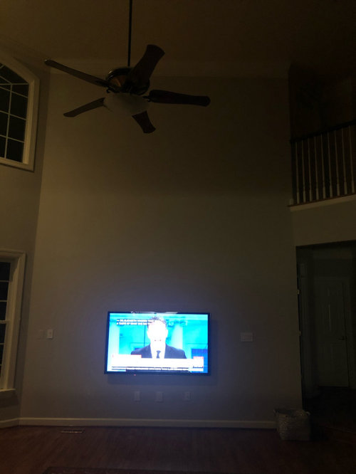 white wall space above TV