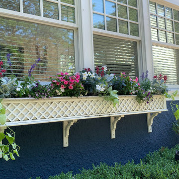 Lattice flower box planted with colorful annuals