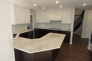 Example of a transitional kitchen design in Calgary