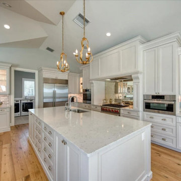 Luxury Custom White Kitchen With Spacious Island And Elegant Cabinetry