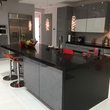 Gray Modern Kitchen Cabinet, Black Caesarstone & Glass Backsplash