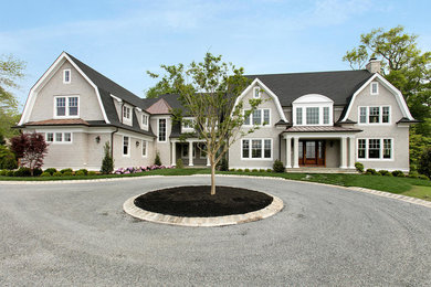 Inspiration for a large timeless gray two-story wood house exterior remodel in New York with a gambrel roof and a shingle roof
