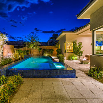 Raised Rim Flow Pool with Custom Fire/Water Feature
