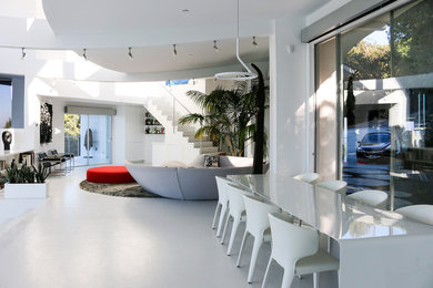 Living room - huge contemporary loft-style concrete floor and white floor living room idea in San Francisco with white walls and no tv