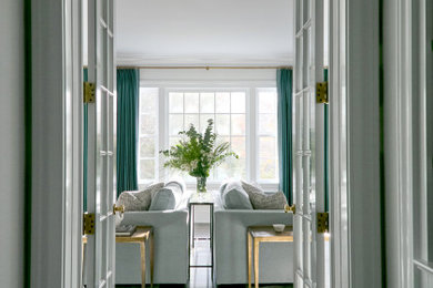 Huge transitional medium tone wood floor hallway photo in New York with white walls