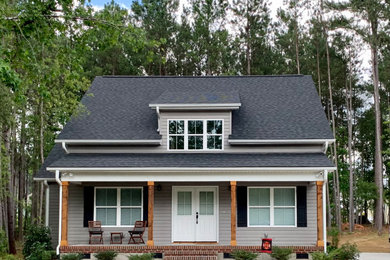 Gray vinyl and clapboard exterior home photo in Other