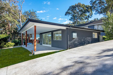 Photo of a small modern home design in Sydney.