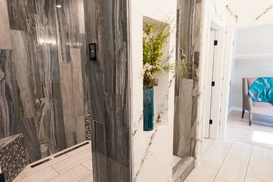 Photo of an expansive contemporary master wet room bathroom in Milwaukee with gray tile, ceramic tile, white walls, ceramic floors, white floor and an open shower.