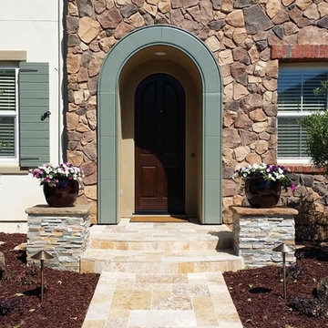 Travertine and Paver Patio with Veneer Stone Walls