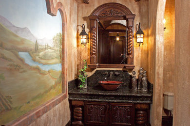 Inspiration for a mediterranean powder room remodel in Orlando