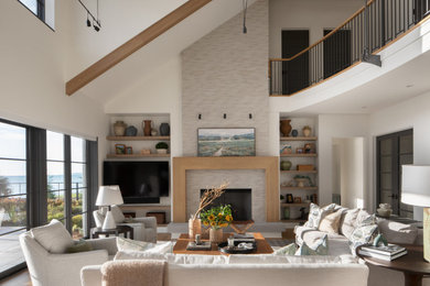 Living room - large transitional open concept living room idea in Milwaukee with a standard fireplace, a stacked stone fireplace and a wall-mounted tv