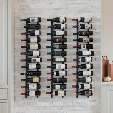 Custom Stacked-Stone Wine Wall with Integrated Lighting