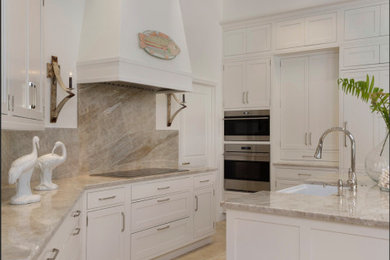 Inspiration for a mid-sized transitional u-shaped porcelain tile and beige floor eat-in kitchen remodel in Miami with an undermount sink, shaker cabinets, white cabinets, quartzite countertops, beige backsplash, paneled appliances, an island and beige countertops