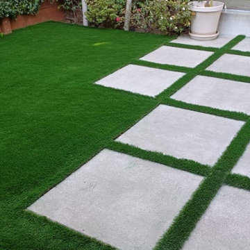 Child-Safe Backyard Extends Chic Indoor Entertainment Area