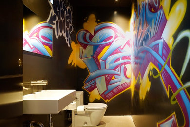 Trendy powder room photo in Los Angeles with a wall-mount sink