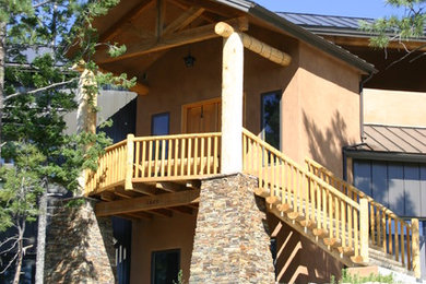 Example of a mixed siding exterior home design in Albuquerque