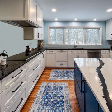 Kitchen with White Perimeter and Blue Island Cabinet Reface