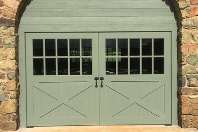 Garage - large country detached four-car garage idea in Other