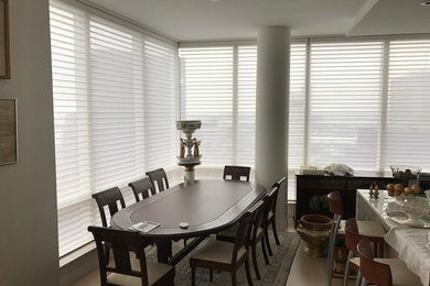 Example of a small transitional beige floor great room design in Boston with gray walls and no fireplace