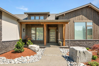 Modern mixed siding house exterior idea in Portland with a mixed material roof