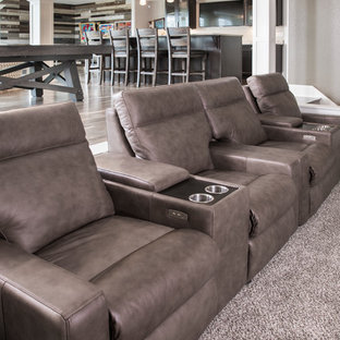 Design ideas for a medium sized contemporary open plan home cinema in Milwaukee with grey walls, carpet and grey floors.