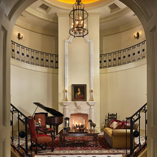 Imagen de salón para visitas abierto, mediterráneo, con chimenea tradicional y suelo multicolor