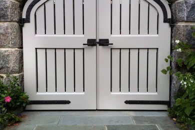 Entryway - craftsman limestone floor entryway idea in Los Angeles with a white front door