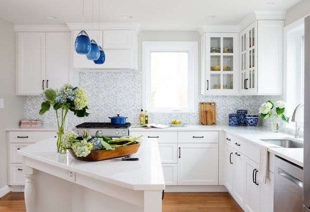 White Cabinets And Blue Accents Brighten A Kitchen
