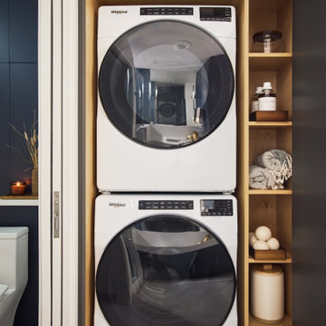 Hidden Laundry Area with Stacked Washer Dryer in Bathroom Cabinetry