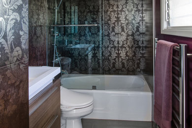 Contemporary bathroom in San Francisco with a wall-mount sink, an alcove tub, a shower/bathtub combo, a two-piece toilet, flat-panel cabinets, medium wood cabinets and porcelain tile.