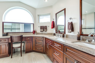Walk-in shower - large contemporary 3/4 white tile and porcelain tile porcelain tile walk-in shower idea in Vancouver with raised-panel cabinets, medium tone wood cabinets, a one-piece toilet, white walls, an undermount sink and granite countertops