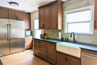 Example of a transitional galley eat-in kitchen design with a peninsula
