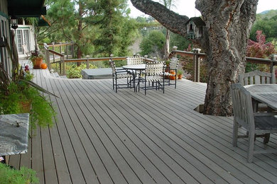 This is an example of a traditional backyard deck in Other.
